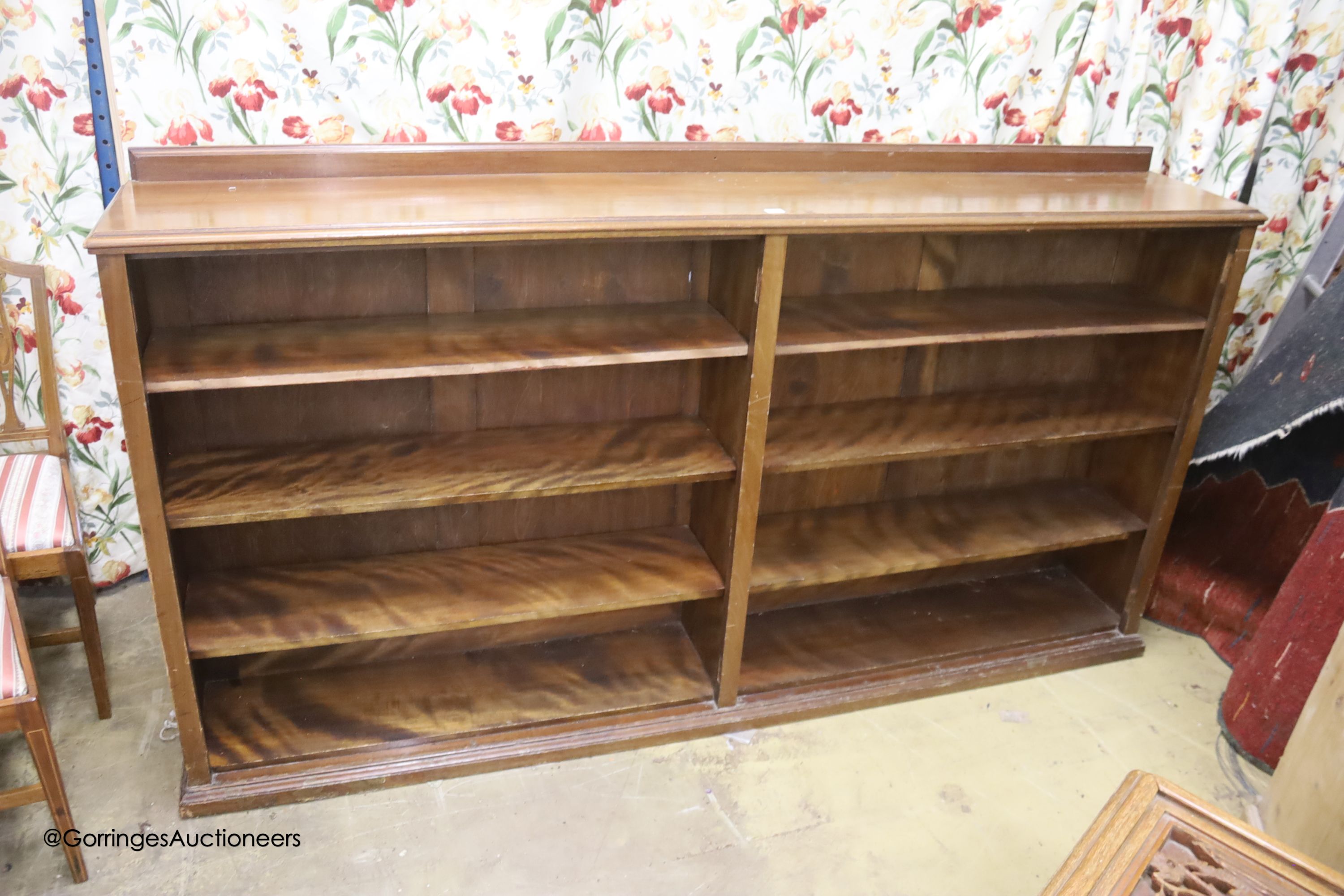 An Edwardian mahogany open bookcase, width 215cm depth 36cm height 115cm